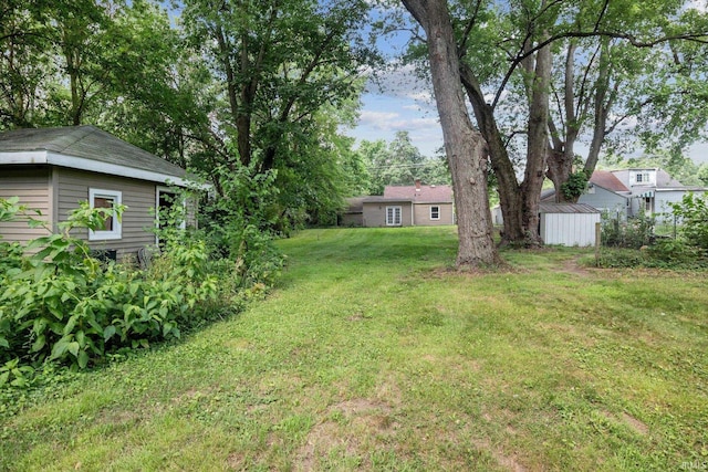 55310 Moss Rd, South Bend, IN 46628 - view of green lawn with a storage shed