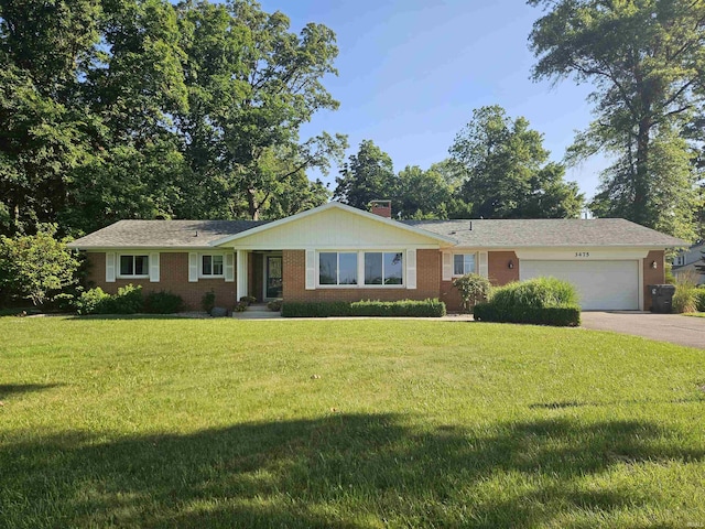 3475 W 1175 N Rd, Decatur, IN 46733 - single story home with a garage, asphalt driveway, a front lawn, brick siding, and a chimney