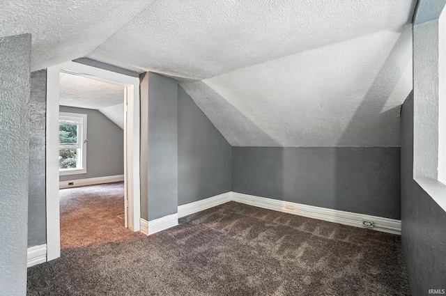106 Mulberry St, Columbia City, IN 46725 - bonus room with carpet, lofted ceiling, and a textured ceiling