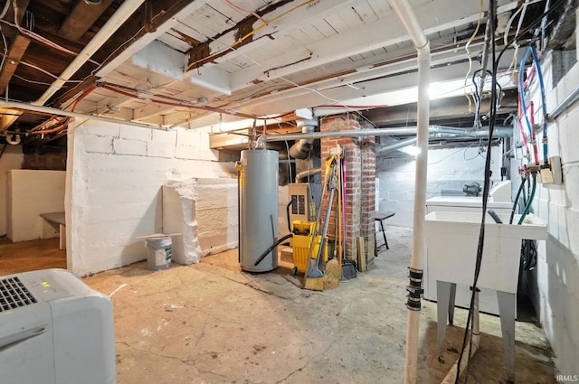 106 Mulberry St, Columbia City, IN 46725 - unfinished below grade area featuring gas water heater and concrete block wall
