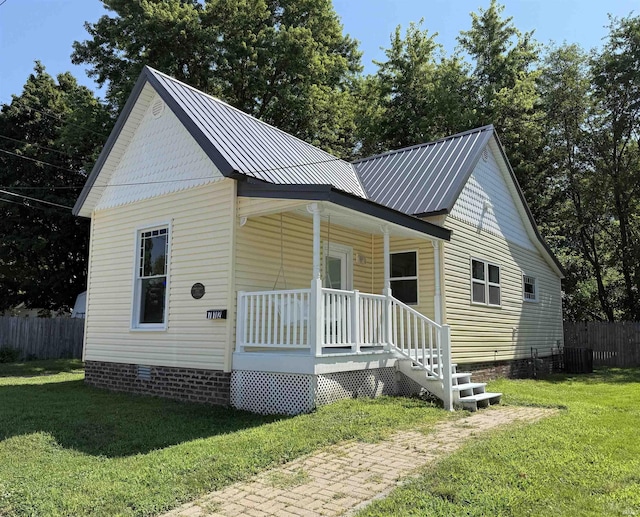 712 N Lindsay St, Kokomo, IN 46901 - view of front of house with covered porch, crawl space, and a metal roof