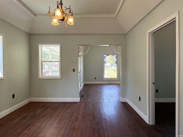 712 N Lindsay St, Kokomo, IN 46901 - empty room featuring dark wood-style floors, a chandelier, and vaulted ceiling
