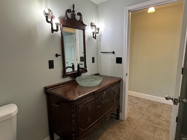 712 N Lindsay St, Kokomo, IN 46901 - bathroom featuring vanity and stone finish floors