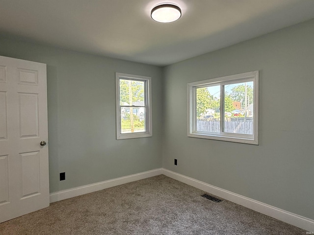 712 N Lindsay St, Kokomo, IN 46901 - carpeted empty room featuring baseboards
