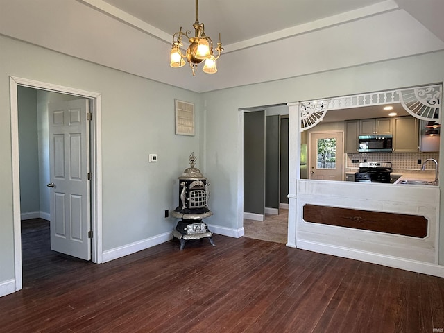 712 N Lindsay St, Kokomo, IN 46901 - dining space featuring a chandelier and dark wood finished floors