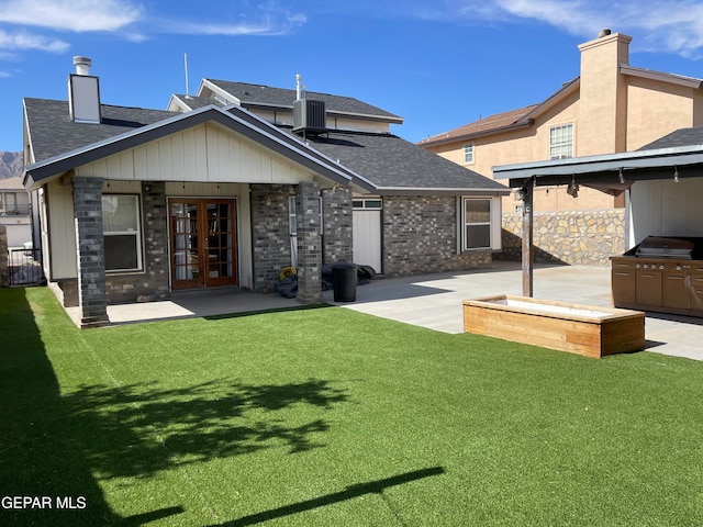 back of house featuring a patio area, french doors, cooling unit, and a lawn