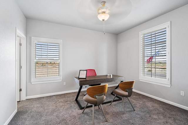 office with carpet, ceiling fan, and a healthy amount of sunlight