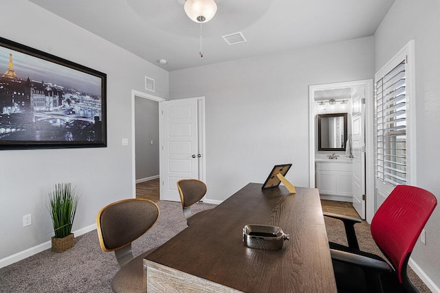 carpeted office featuring sink