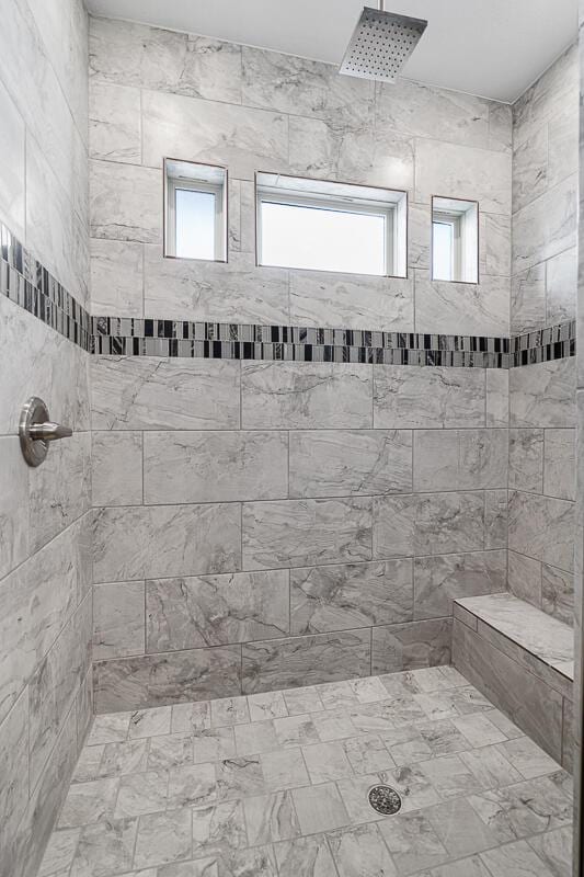 bathroom with tiled shower