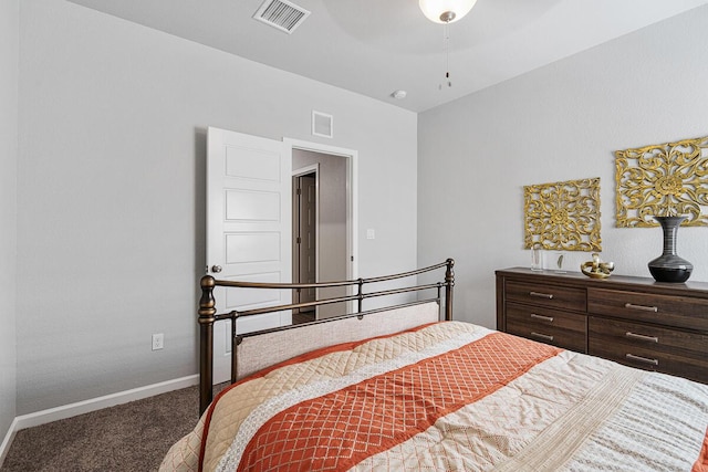 bedroom with ceiling fan and carpet floors