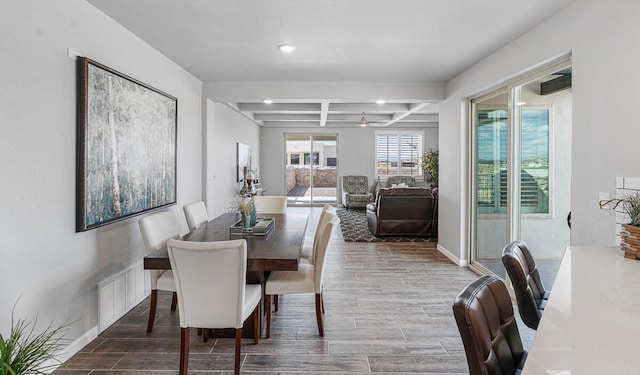 dining area with ceiling fan, hardwood / wood-style floors, beamed ceiling, and coffered ceiling