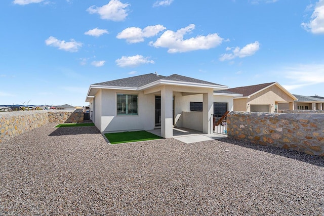 back of property with a patio area