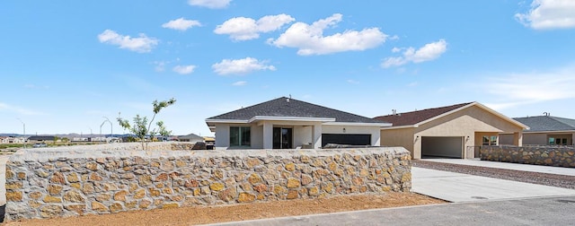 ranch-style house featuring a garage