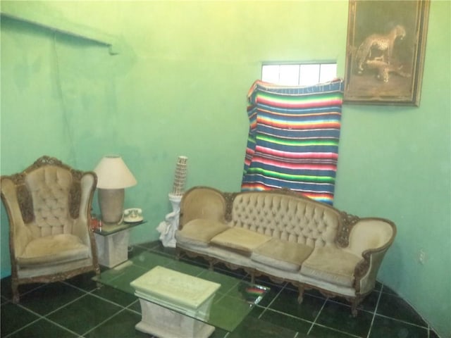 sitting room featuring dark tile floors