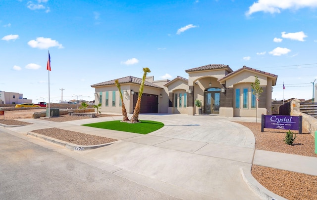 2425 Cesar Cordova Pl, El Paso, TX 79938 - mediterranean / spanish-style home with a garage