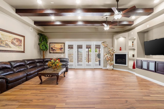 2425 Cesar Cordova Pl, El Paso, TX 79938 - living room featuring ceiling fan, beam ceiling, light hardwood / wood-style flooring, built in shelves, and french doors
