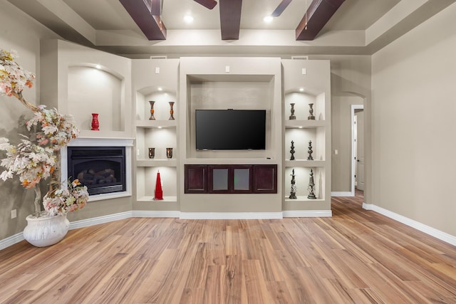 2425 Cesar Cordova Pl, El Paso, TX 79938 - unfurnished living room featuring built in features, light hardwood / wood-style floors, and ceiling fan