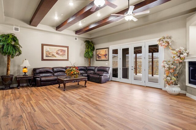 2425 Cesar Cordova Pl, El Paso, TX 79938 - living room with beamed ceiling, french doors, ceiling fan, and light hardwood / wood-style flooring