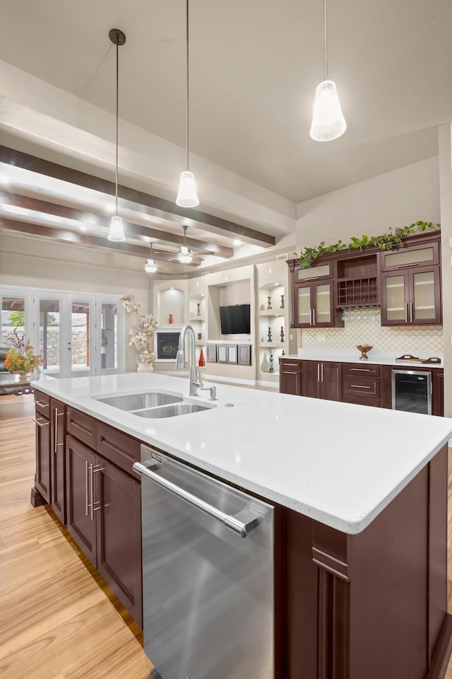 2425 Cesar Cordova Pl, El Paso, TX 79938 - kitchen with an island with sink, decorative light fixtures, dishwasher, and sink