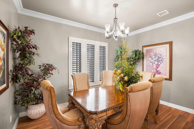 2425 Cesar Cordova Pl, El Paso, TX 79938 - dining area featuring an inviting chandelier, ornamental molding, and hardwood / wood-style flooring