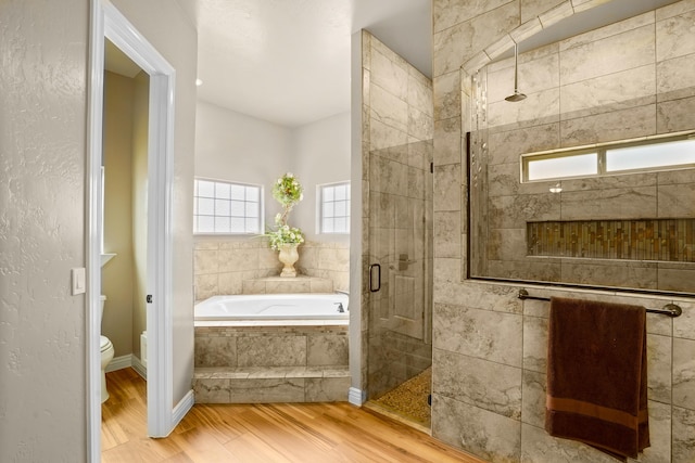 2425 Cesar Cordova Pl, El Paso, TX 79938 - bathroom with separate shower and tub, toilet, and wood-type flooring