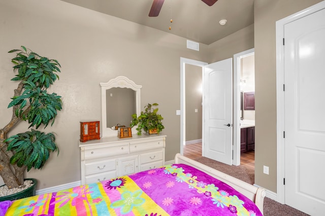 2425 Cesar Cordova Pl, El Paso, TX 79938 - carpeted bedroom with connected bathroom and ceiling fan