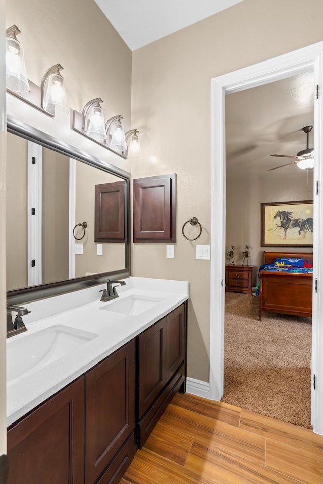 2425 Cesar Cordova Pl, El Paso, TX 79938 - bathroom featuring ceiling fan, vanity with extensive cabinet space, and double sink