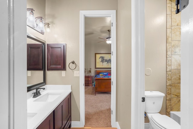 2425 Cesar Cordova Pl, El Paso, TX 79938 - bathroom with vanity, ceiling fan, and toilet