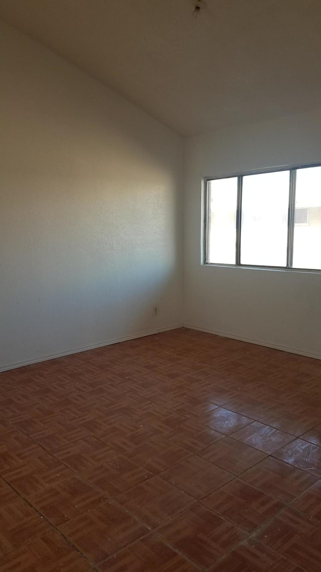 empty room featuring dark parquet floors