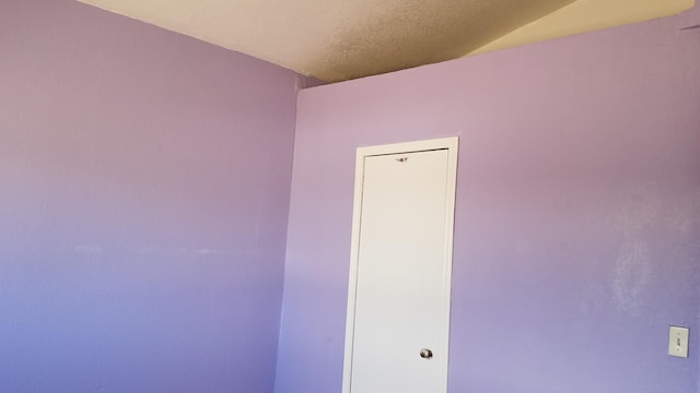 empty room with a textured ceiling