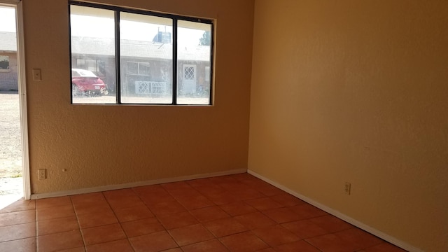 view of tiled spare room