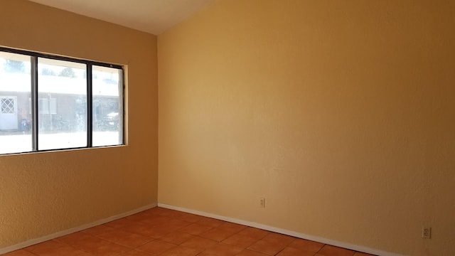 spare room featuring light tile flooring