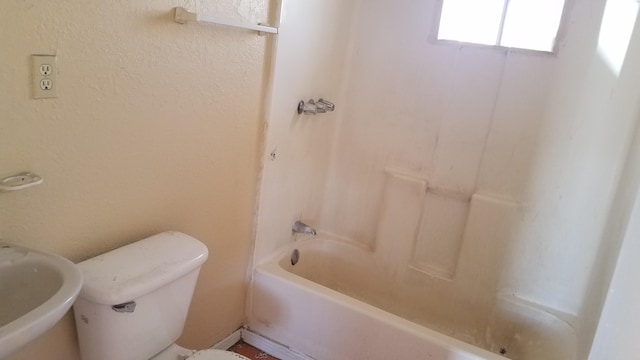 full bathroom with toilet, shower / bathing tub combination, and sink