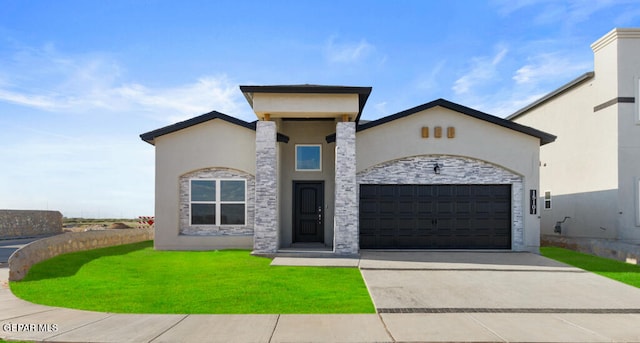 view of front of house with a front lawn and a garage