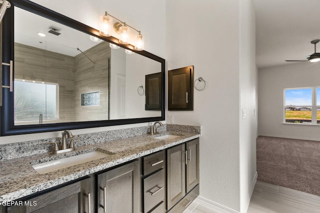 bathroom with tile floors, ceiling fan, and dual bowl vanity