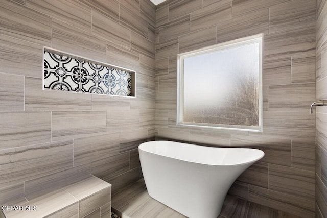 bathroom with tile walls