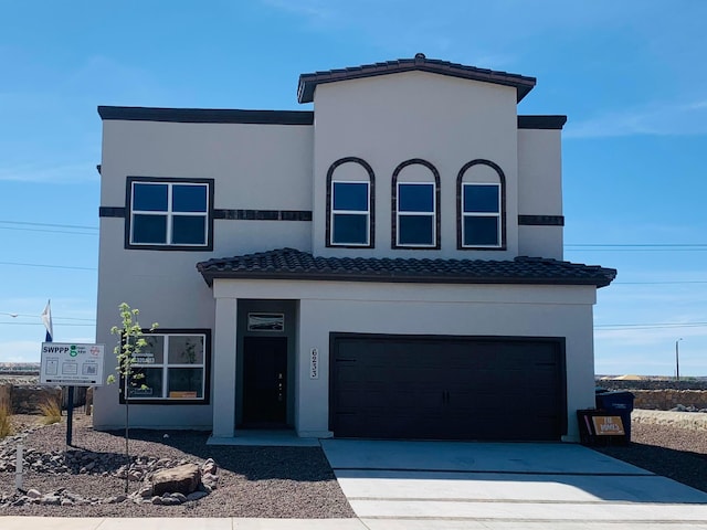 view of front of property featuring a garage