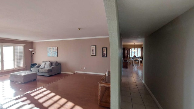 interior space with dark tile floors and crown molding