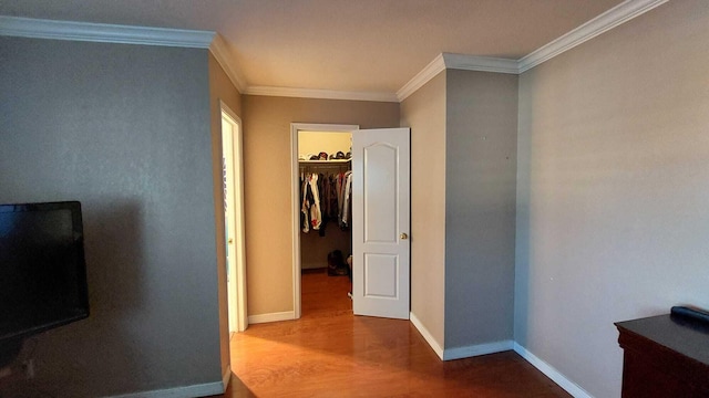 hallway featuring crown molding and dark wood-type flooring