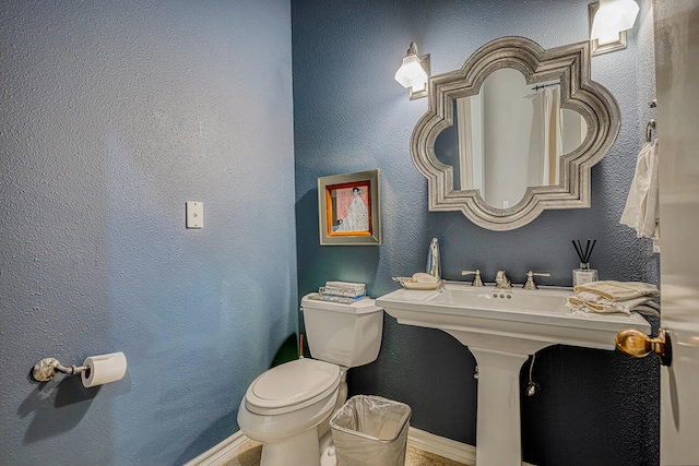 bathroom featuring toilet