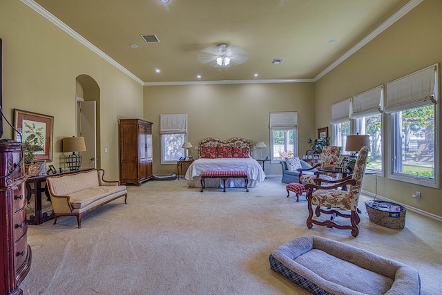 carpeted bedroom with a towering ceiling and crown molding