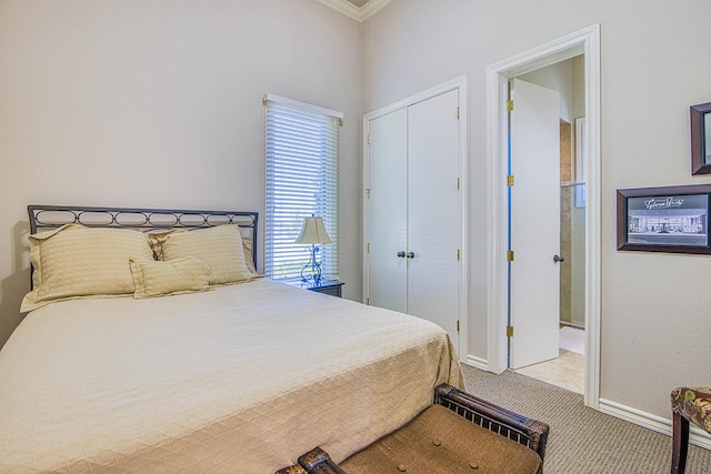 carpeted bedroom featuring a closet and crown molding