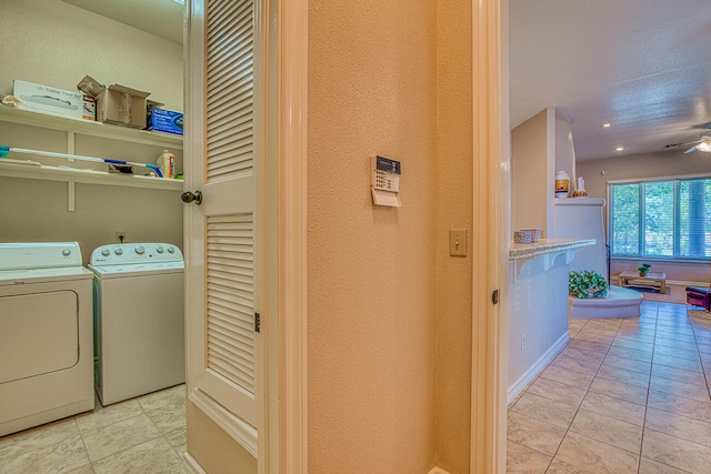 clothes washing area featuring light tile floors, ceiling fan, and independent washer and dryer