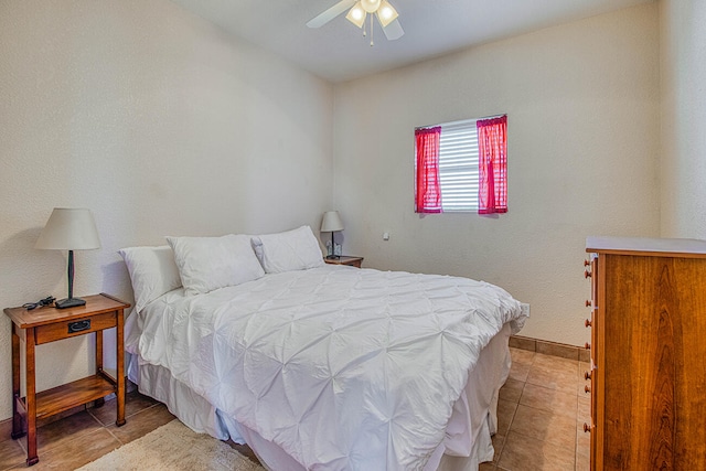 bedroom featuring light tile flooring and ceiling fan