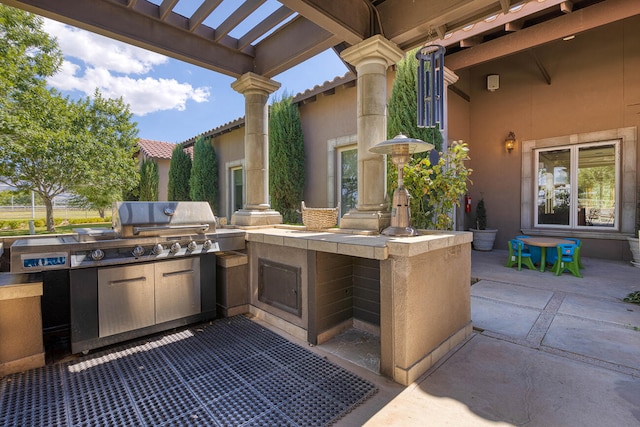 view of patio with an outdoor kitchen