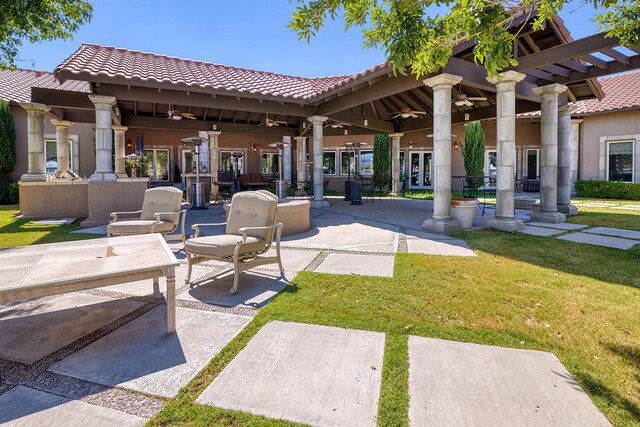 exterior space featuring a pergola, a lawn, and a patio area