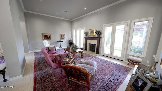 tiled living room featuring crown molding and french doors