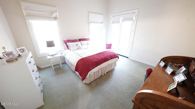 bedroom with dark colored carpet