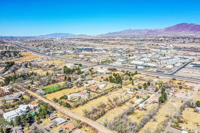 birds eye view of property with a mountain view