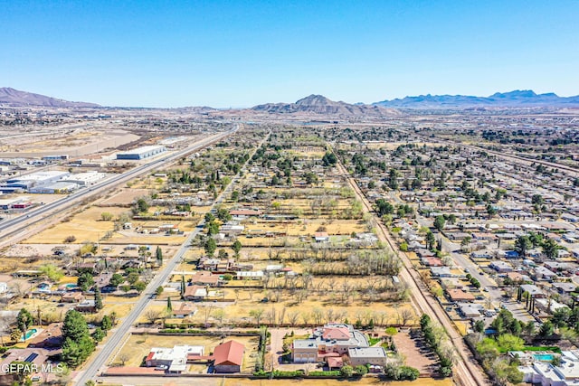 birds eye view of property with a mountain view